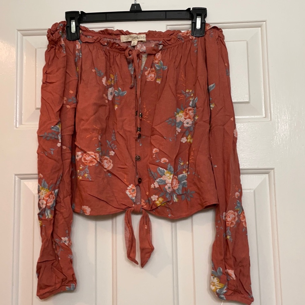 Off the shoulder, long sleeve shirt that stops right at the waist